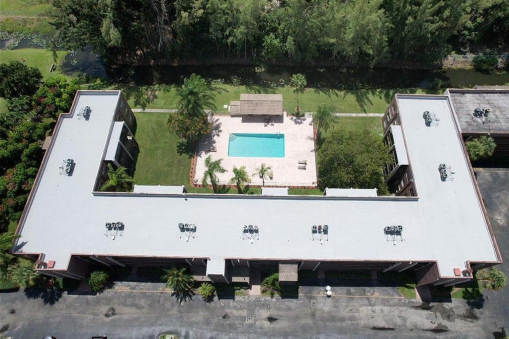 Hot Asphalt After Commercial Reroofing on Apartment Building in Miramar, FL