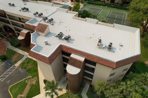 Hot Asphalt After Commercial Reroofing on Apartment Building in Lauderhill, FL