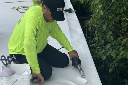 Commercial Roofing Contractor Working on St. Gregory's Building in Plantation, FL