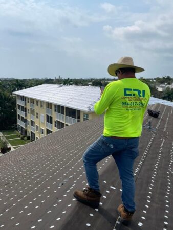 Commercial roofing contractor on a roof in Tamarac, FL