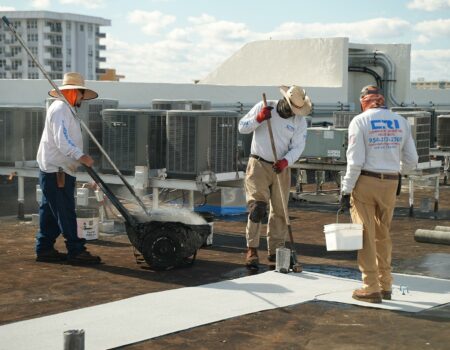 contractors working on a roof performing Hurricane Roof Repair